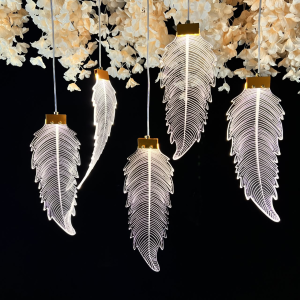 Feather Pendant Lights MLA102 — Delicate feather silhouettes with a luminous outline.