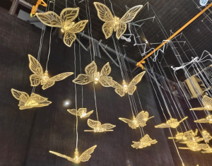 Butterfly Pendant Lights MLA106 — Suspended butterfly forms with a warm golden glow.